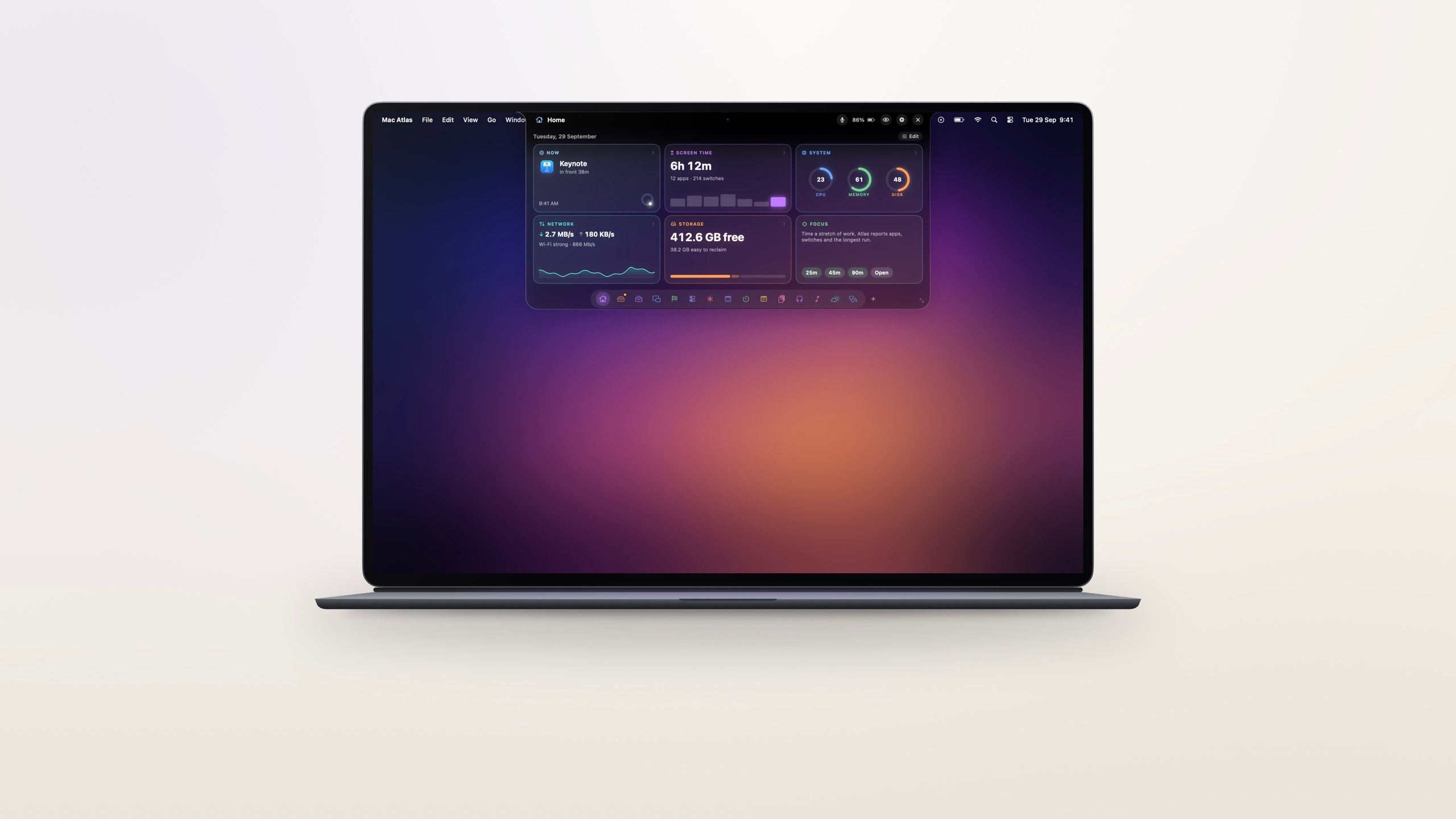 A MacBook with the Mac Atlas island open on Home.